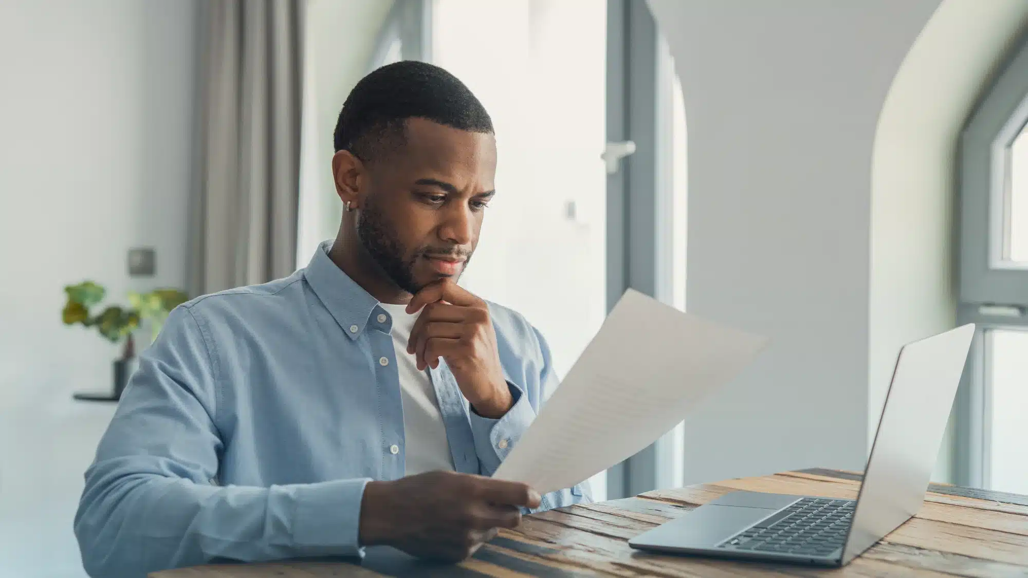 how-oxford-ct-residents-can-compare-available-supplement-plans-for-better-healthcare-coverage Senior in Oxford Connecticut comparing Medicare Supplement insurance plans using documents showing coverage options, premiums, and Medigap plan details