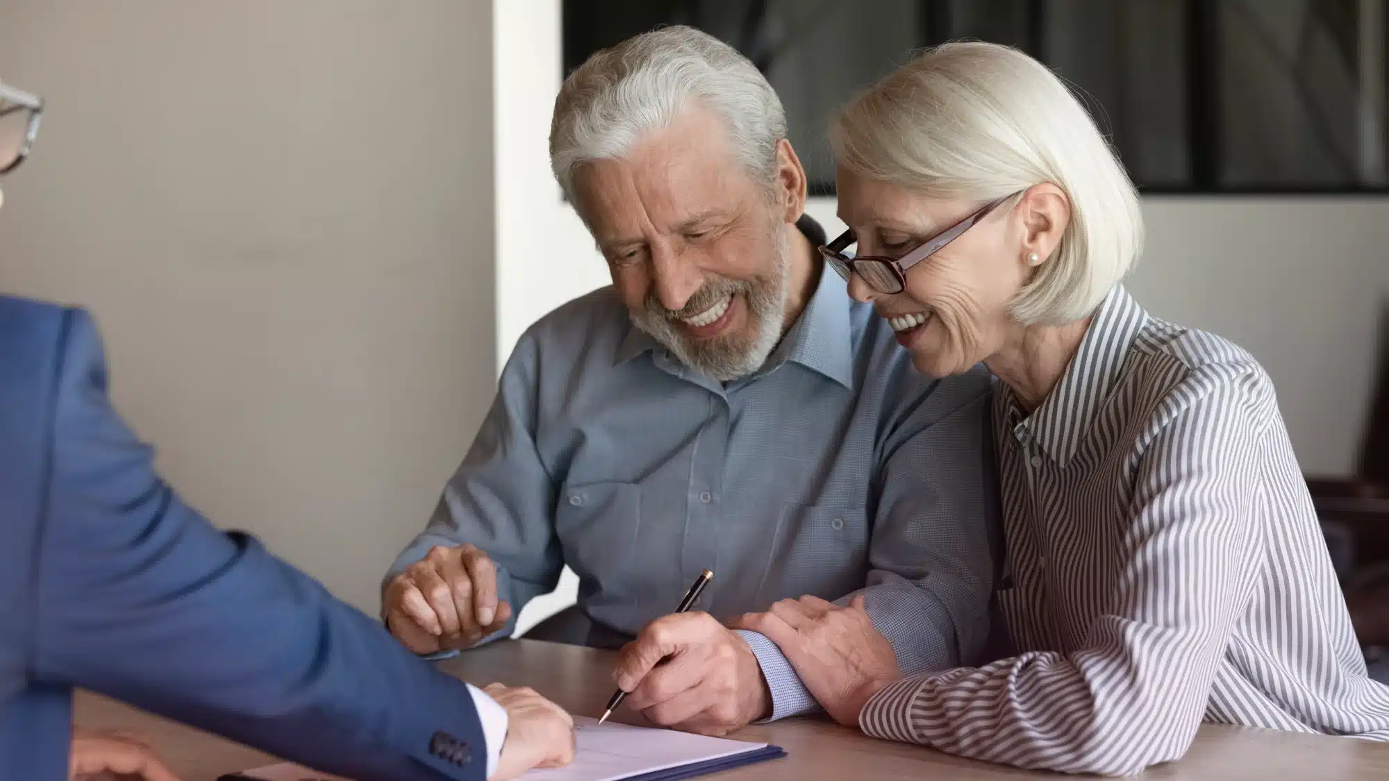 what-medicare-advantage-plans-in-niantic-offer-for-coverage-benefits-and-savings Smiling senior couple reviewing medical documents together